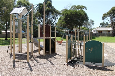 Small playground with a slide and swing