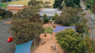 Arieal image of trees, car park, playground