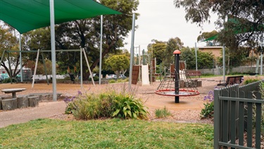 Playground with swings, climbing equipment and sunshades